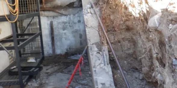 Clear retaining wall weep holes and drains