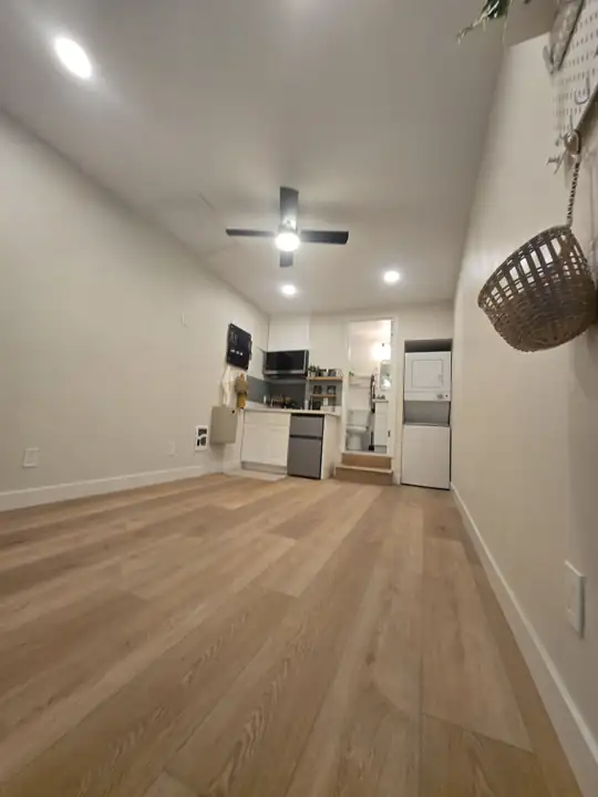 Studio: LVP floor, recessed lights